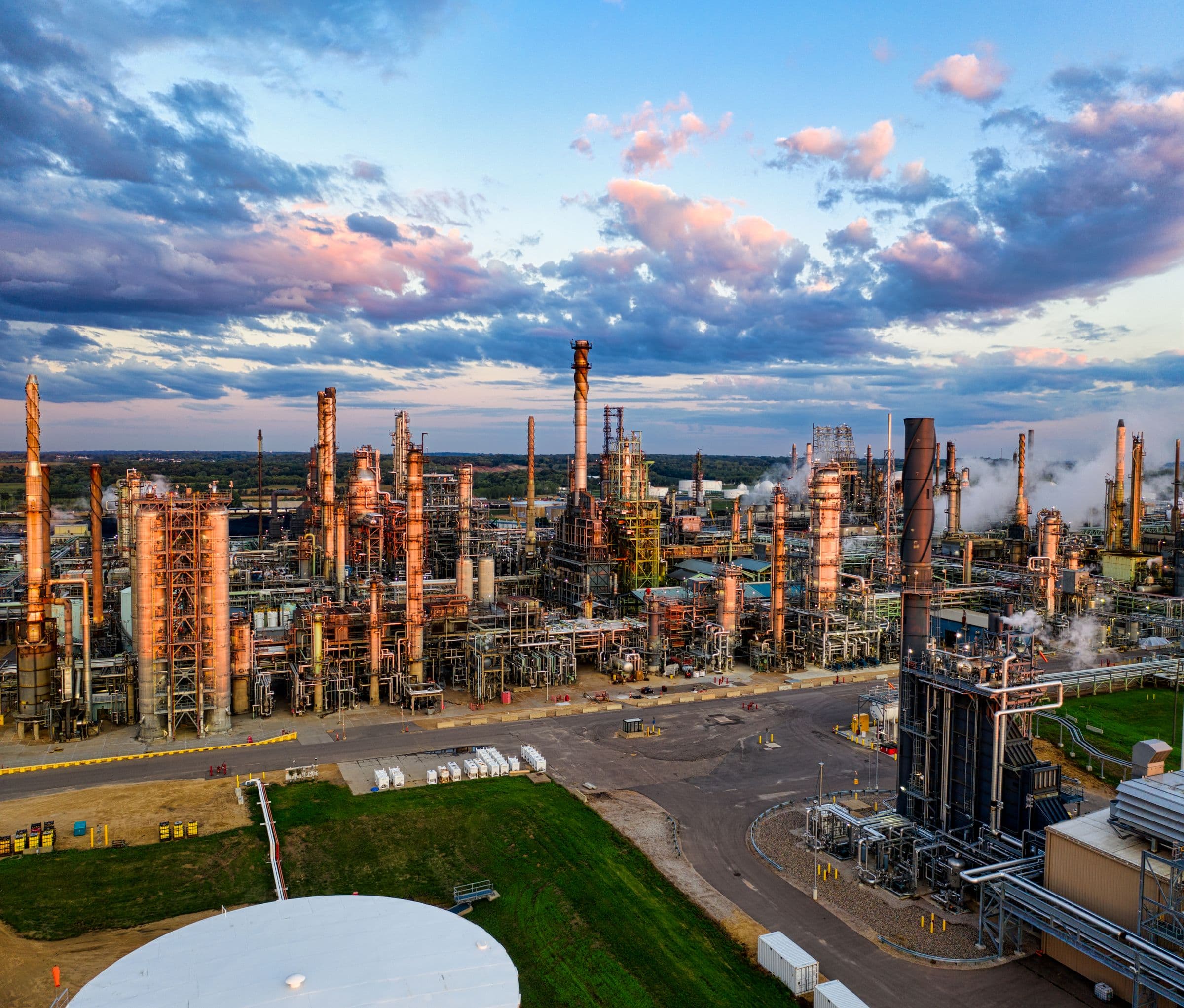 Aerial view of a working oil refinery at sunset
